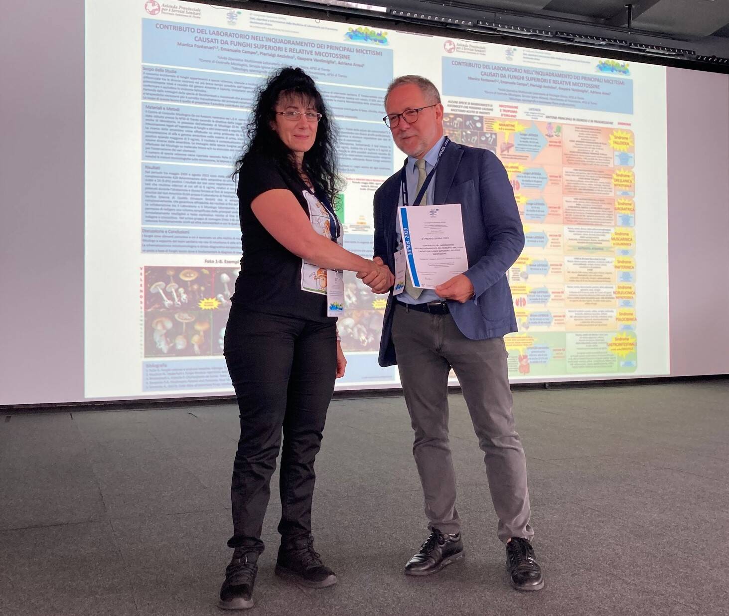 Immagine: Monica Fontanari con Maurizio Papa.jpg Creative Commons Attributon–ShareAlike 4.0 International (CC BY-SA 4.0)